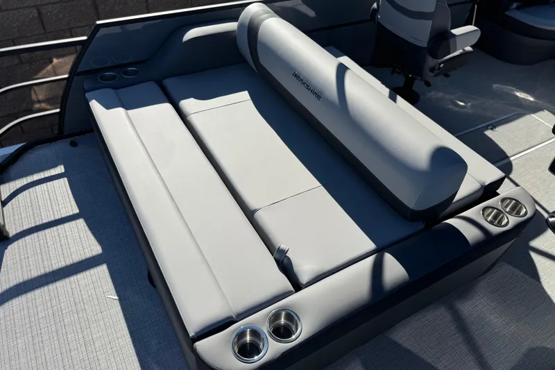 Slide: The Image of 2026 Berkshire 22UL CTS boat interior with gray seating and cup holders. - 17