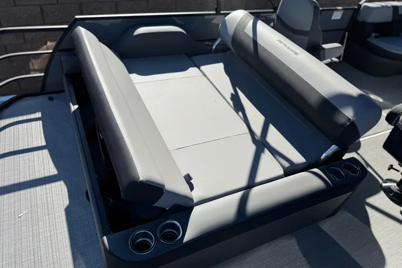 Slide: The Image of 2026 Berkshire 22UL CTS boat interior with gray seating and cup holders. - 19
