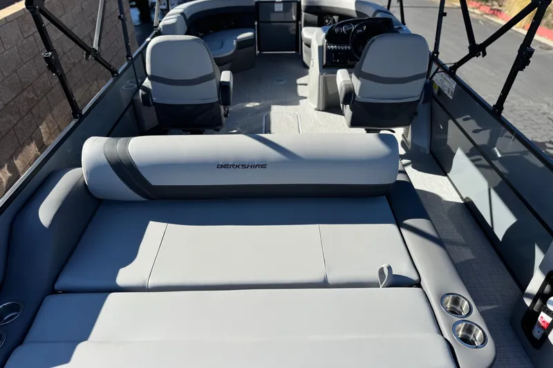Slide: The Image of 2026 Berkshire 22UL CTS pontoon boat interior with gray seating and cup holders. - 22
