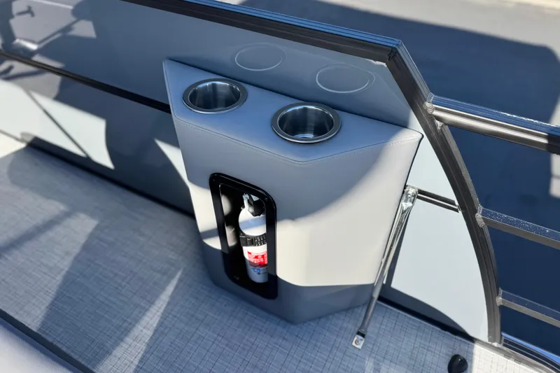 Slide: The Image of 2026 Berkshire 22UL CTS boat cup holders and fire extinguisher storage. - 23