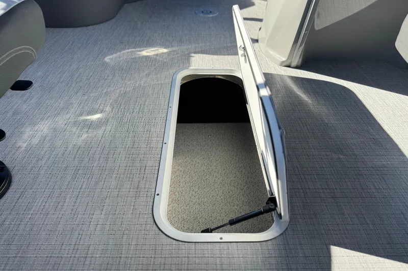 Slide: The Image of Open storage compartment on 2026 Berkshire 22UL CTS boat deck. - 24