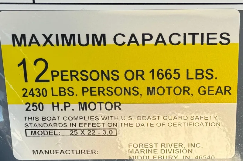 Slide: The Image of 2026 Berkshire 22UL CTS boat capacity label: 12 persons, 1665 lbs, 250 HP motor. - 30