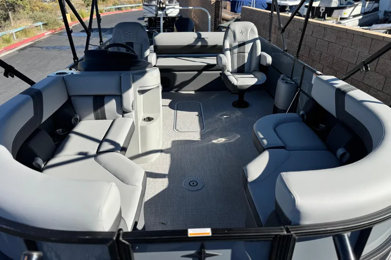 Slide: The Image of 2026 Berkshire 22UL CTS pontoon boat interior with gray seating and spacious layout. - 9
