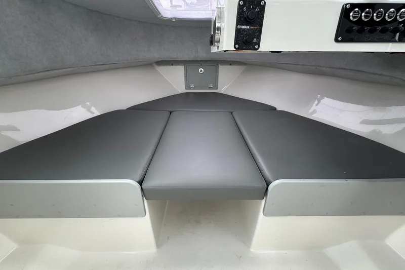 Slide: The Image of Interior cabin of 2026 Defiance Admiral 220 EX boat with cushioned seating. - 48