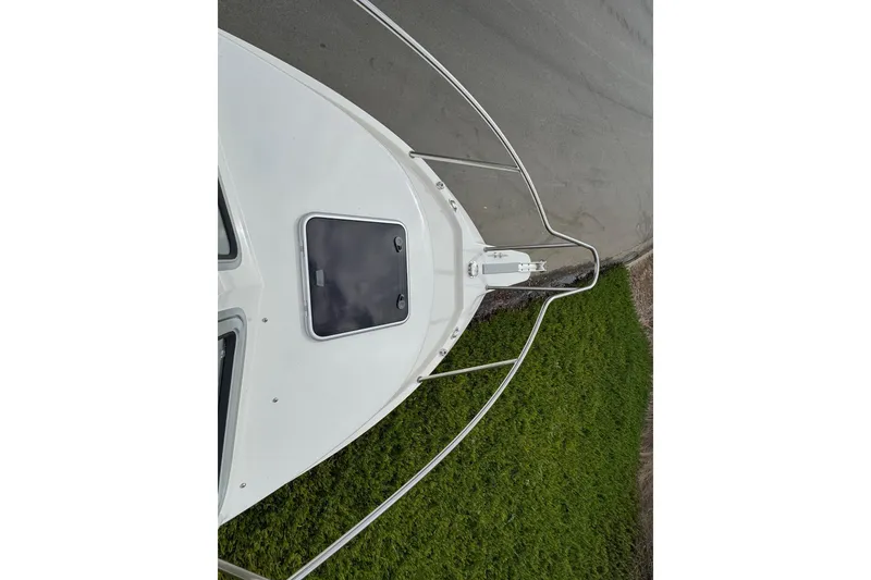 Slide: The Image of Bow view of 2026 Defiance Admiral 220 EX boat with railing and hatch. - 59