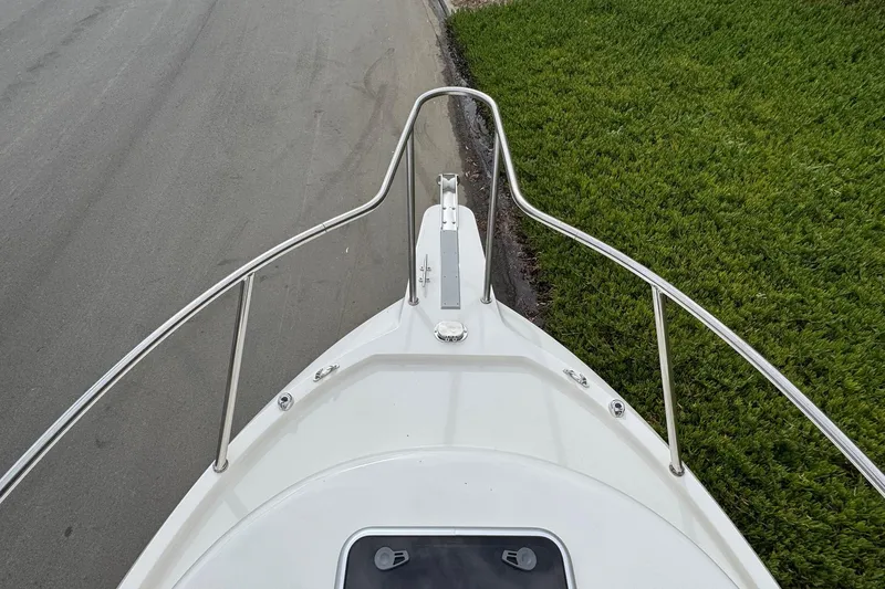 Slide: The Image of Bow view of 2026 Defiance Admiral 220 EX boat, featuring sleek railings and deck design. - 60