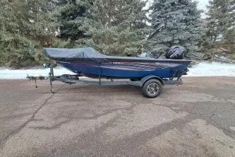 The Image of 2022 Ranger VS1665T boat on trailer in winter forest. - 1