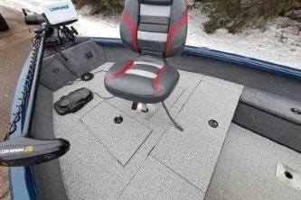 Slide: The Image of 2022 Ranger VS1665T fishing boat with dual seats, parked on snowy driveway. - 11