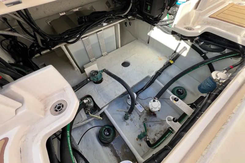 Slide: The Image of 2021 Grady-White Marlin 300 boat interior showing engine compartment and wiring. - 11