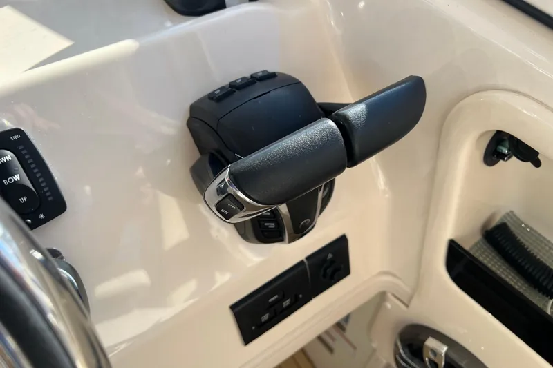 Slide: The Image of Throttle control of 2021 Grady-White Marlin 300 boat cockpit. - 17