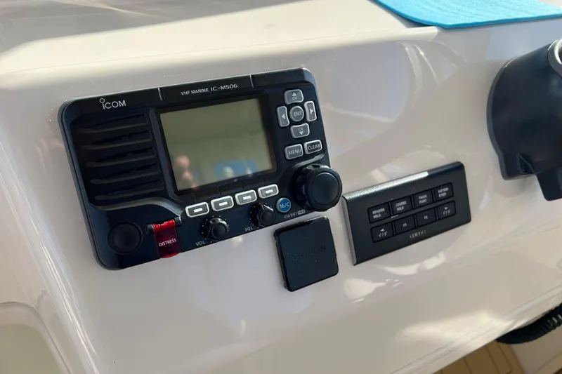 Slide: The Image of Control panel of 2021 Grady-White Marlin 300 boat with Icom VHF radio. - 18
