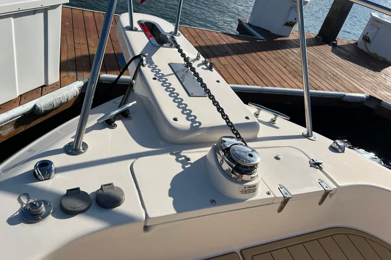 Slide: The Image of 2021 Grady-White Marlin 300 boat deck with anchor chain and winch. - 20