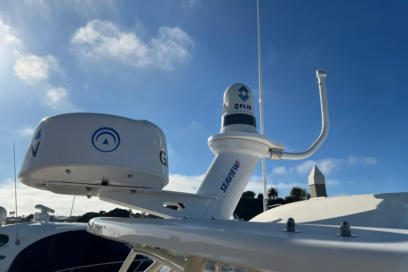 Slide: The Image of Radar and camera equipment on a 2021 Grady-White Marlin 300 boat under a clear sky. - 22
