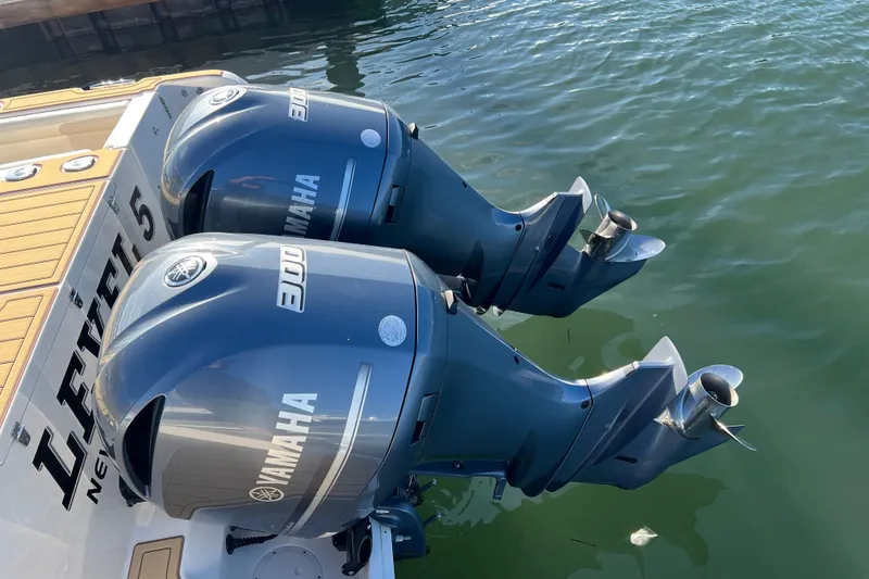 Slide: The Image of Twin Yamaha 300 engines on a 2021 Grady-White Marlin 300 boat. - 23