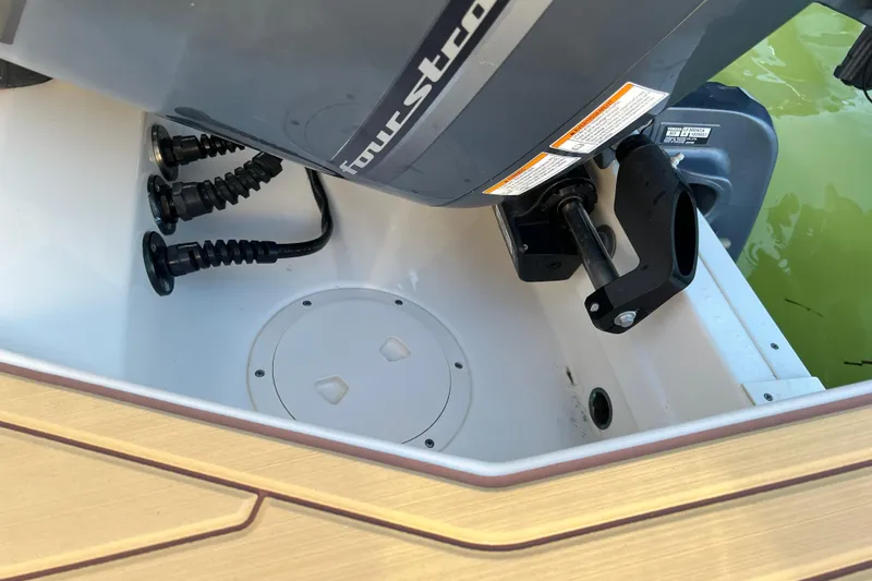 Slide: The Image of 2021 Grady-White Marlin 300 boat engine compartment with four-stroke motor details. - 24