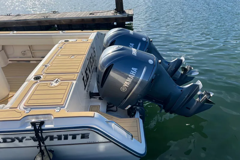 Slide: The Image of 2021 Grady-White Marlin 300 boat with twin Yamaha outboard engines docked. - 4