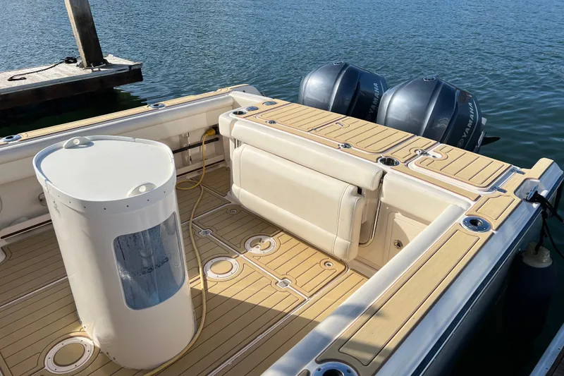 Slide: The Image of 2021 Grady-White Marlin 300 boat deck with twin Yamaha outboard engines. - 5