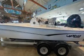 Slide: The Image of 2025 Mako Pro Skiff 19 CC boat on trailer in showroom. - 70