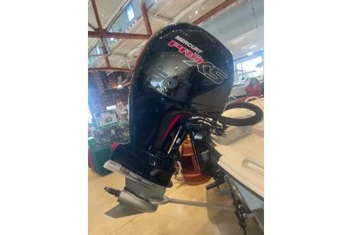 Slide: The Image of 2025 Mako Pro Skiff 19 CC with Mercury outboard motor in showroom. - 75