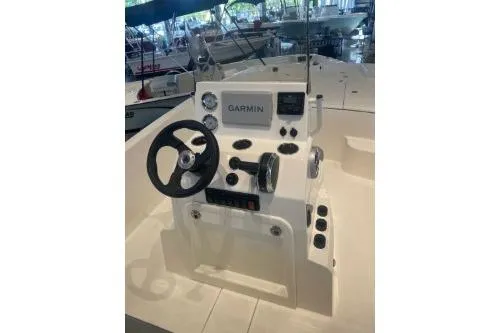 Slide: The Image of 2025 Mako Pro Skiff 19 CC boat console with Garmin navigation system. - 76