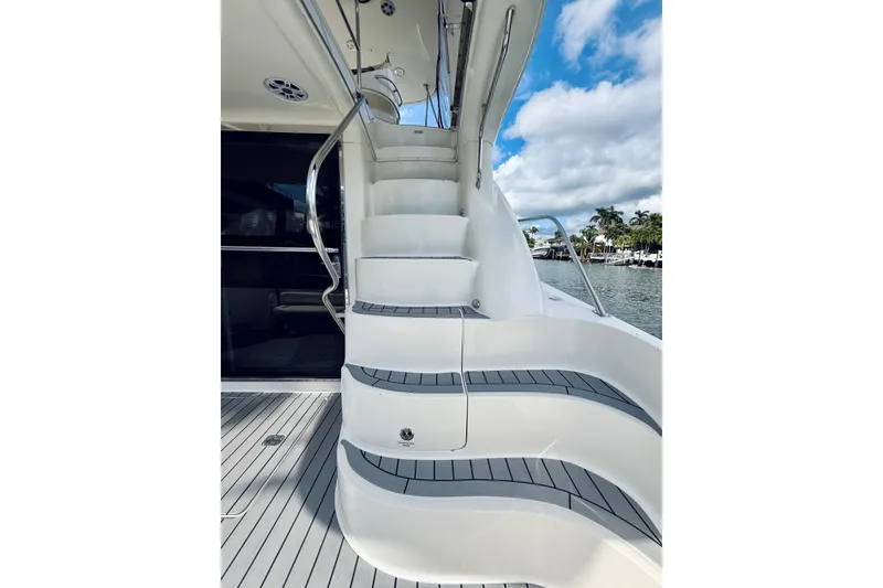 Slide: The Image of Staircase on 2003 Sea Ray 560 Sedan Bridge yacht, with sleek design and waterfront view. - 20
