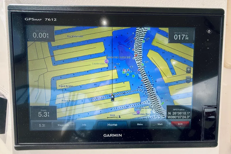 Slide: The Image of Garmin GPS display on 2003 Sea Ray 560 Sedan Bridge, showing nautical map and coordinates. - 33