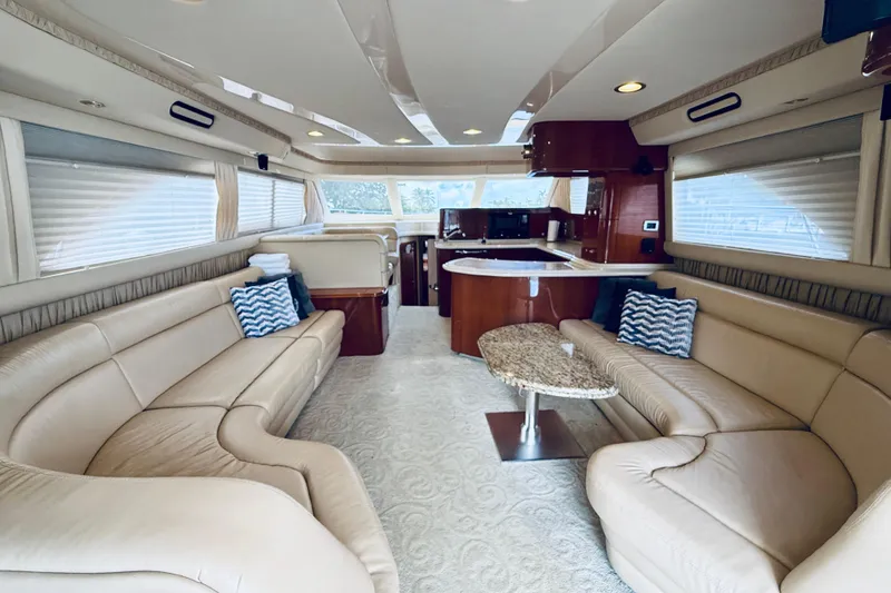 Slide: The Image of Luxurious interior of a 2003 Sea Ray 560 Sedan Bridge yacht with plush seating and elegant decor. - 39