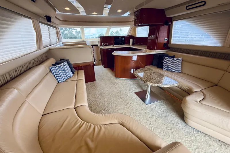 Slide: The Image of Luxurious interior of 2003 Sea Ray 560 Sedan Bridge yacht with plush seating and elegant decor. - 40