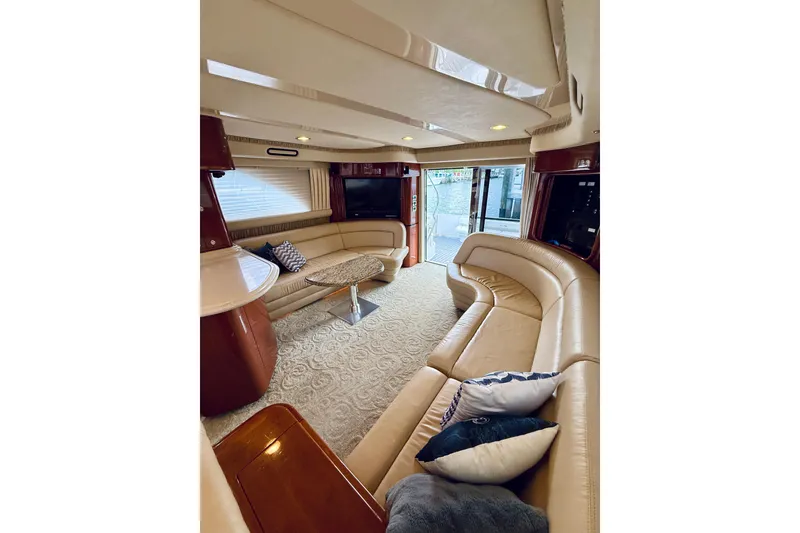 Slide: The Image of Luxurious interior of 2003 Sea Ray 560 Sedan Bridge yacht with plush seating and elegant decor. - 41