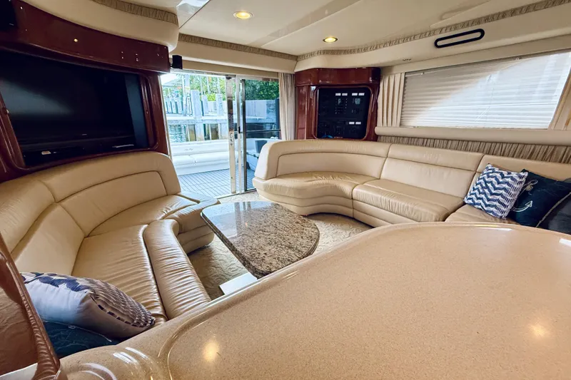 Slide: The Image of Luxurious interior of 2003 Sea Ray 560 Sedan Bridge yacht with plush seating and elegant decor. - 44