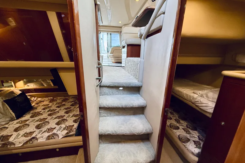 Slide: The Image of Interior of 2003 Sea Ray 560 Sedan Bridge yacht with cozy cabins and carpeted stairs. - 52