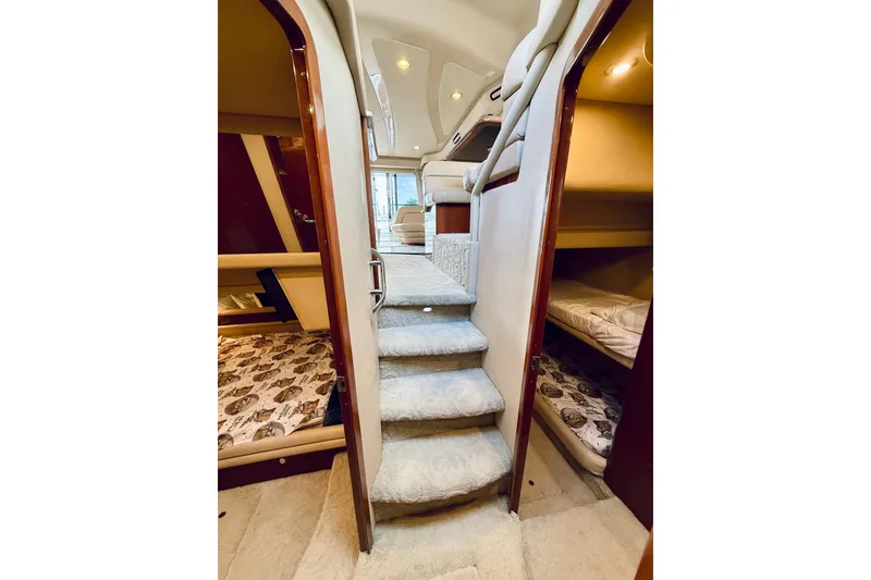 Slide: The Image of Luxurious interior of 2003 Sea Ray 560 Sedan Bridge yacht with plush carpeting and cozy cabins. - 53