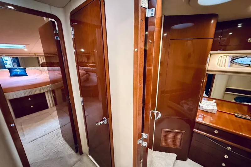 Slide: The Image of Luxurious interior of 2003 Sea Ray 560 Sedan Bridge yacht with wood finishes. - 56
