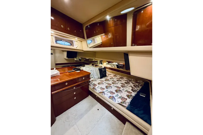 Slide: The Image of Luxurious cabin interior of 2003 Sea Ray 560 Sedan Bridge yacht with wood cabinetry. - 60