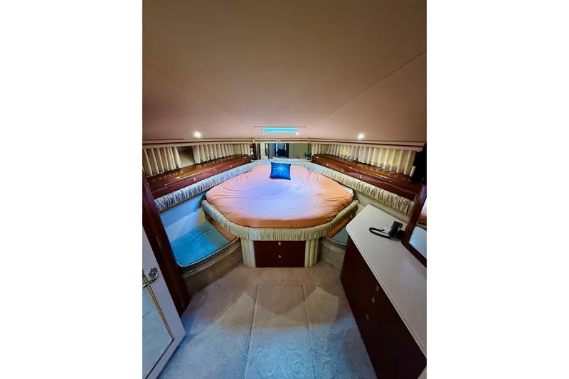 Slide: The Image of Luxurious 2003 Sea Ray 560 Sedan Bridge yacht bedroom interior with elegant bedding. - 62