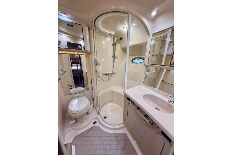 Slide: The Image of Luxurious bathroom in 2003 Sea Ray 560 Sedan Bridge yacht with shower and vanity. - 66