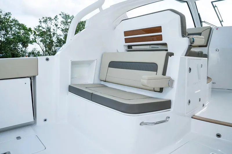 Slide: The Image of Manufacturer Provided Image: 2019 Pursuit DC 365 Dual Console boat interior seating area. - 23