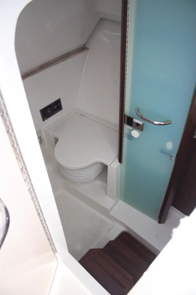 Slide: The Image of 2019 Pursuit DC 365 Dual Console boat interior with modern bathroom amenities. - 32