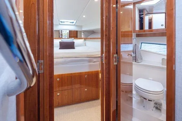 Slide: The Image of Luxurious interior of 2019 Riviera 395 SUV yacht with bedroom and bathroom. - 13