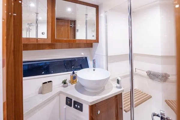 Slide: The Image of Luxurious bathroom interior of 2019 Riviera 395 SUV yacht with modern fixtures and elegant design. - 17