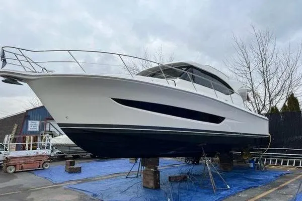 Slide: The Image of 2019 Riviera 395 SUV yacht on dry dock, side view. - 34