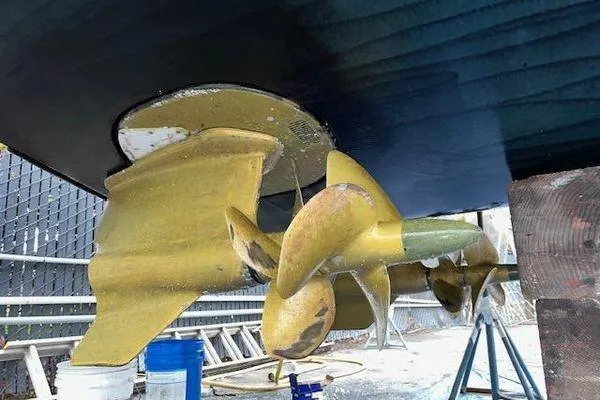 Slide: The Image of Close-up of 2019 Riviera 395 SUV boat propeller and rudder in dry dock. - 35
