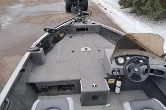 Slide: The Image of 2013 Crestliner 1650 Fish Hawk boat on trailer, parked outdoors. - 3