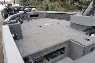 Slide: The Image of 2013 Crestliner 1650 Fish Hawk with Mercury outboard motor, parked on snowy pavement. - 5