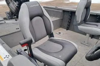 Slide: The Image of 2013 Crestliner 1650 Fish Hawk boat interior with carpeted deck and storage compartments. - 6