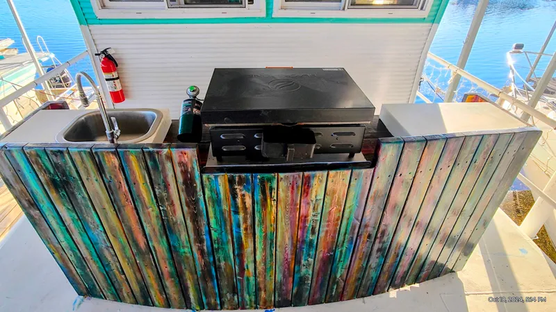 Slide: The Image of Colorful kitchen area on a 1964 Kelly 62' boat. - 13