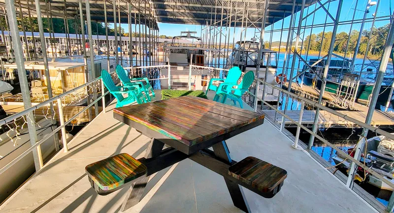 Slide: The Image of Colorful deck on a 1964 Kelly 62' boat overlooking the marina. - 14