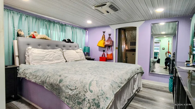 Slide: The Image of Cozy bedroom in a 1964 Kelly 62' RV. - 20