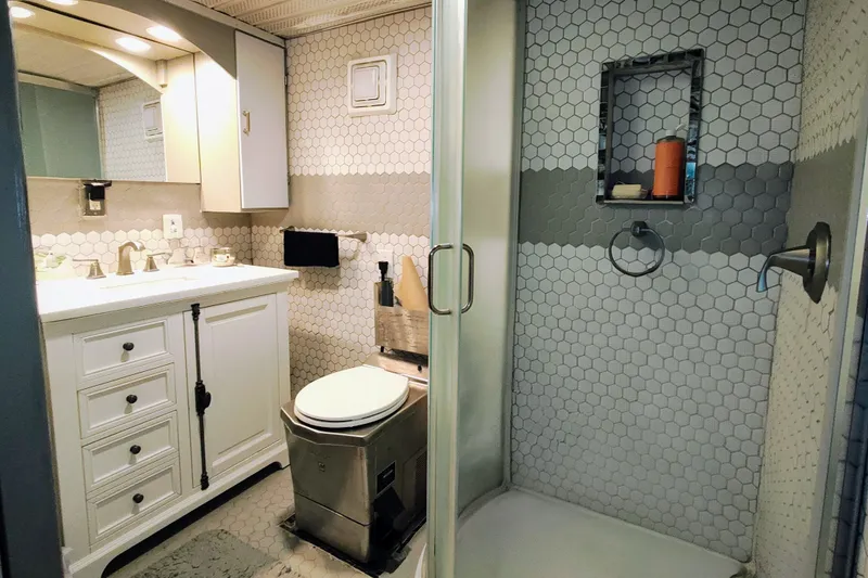 Slide: The Image of Modern bathroom with hexagonal tiles and shower, 1964 Kelly 62'. - 25