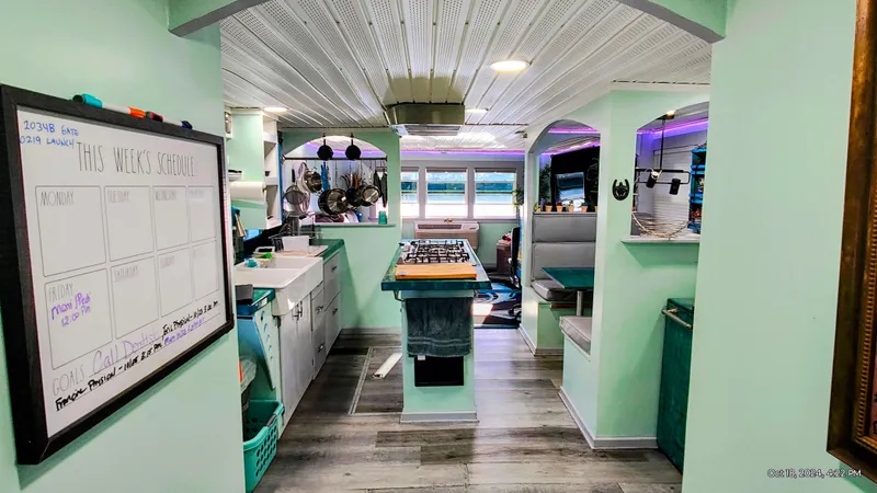 Slide: The Image of Interior of a renovated 1964 Kelly 62' with modern kitchen. - 30